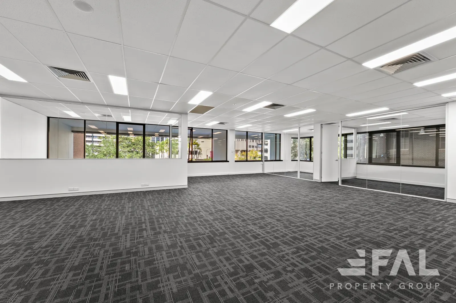 Open-plan office area with glazed rooms in the 241 sqm Lot 4 suite