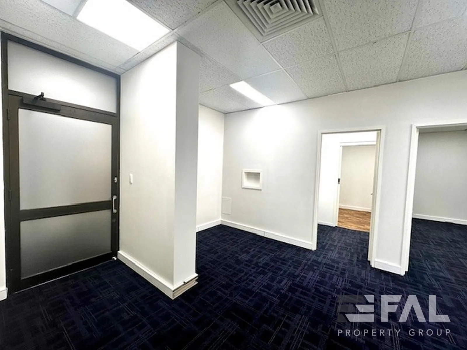 Internal office entry and adjoining partitioned rooms